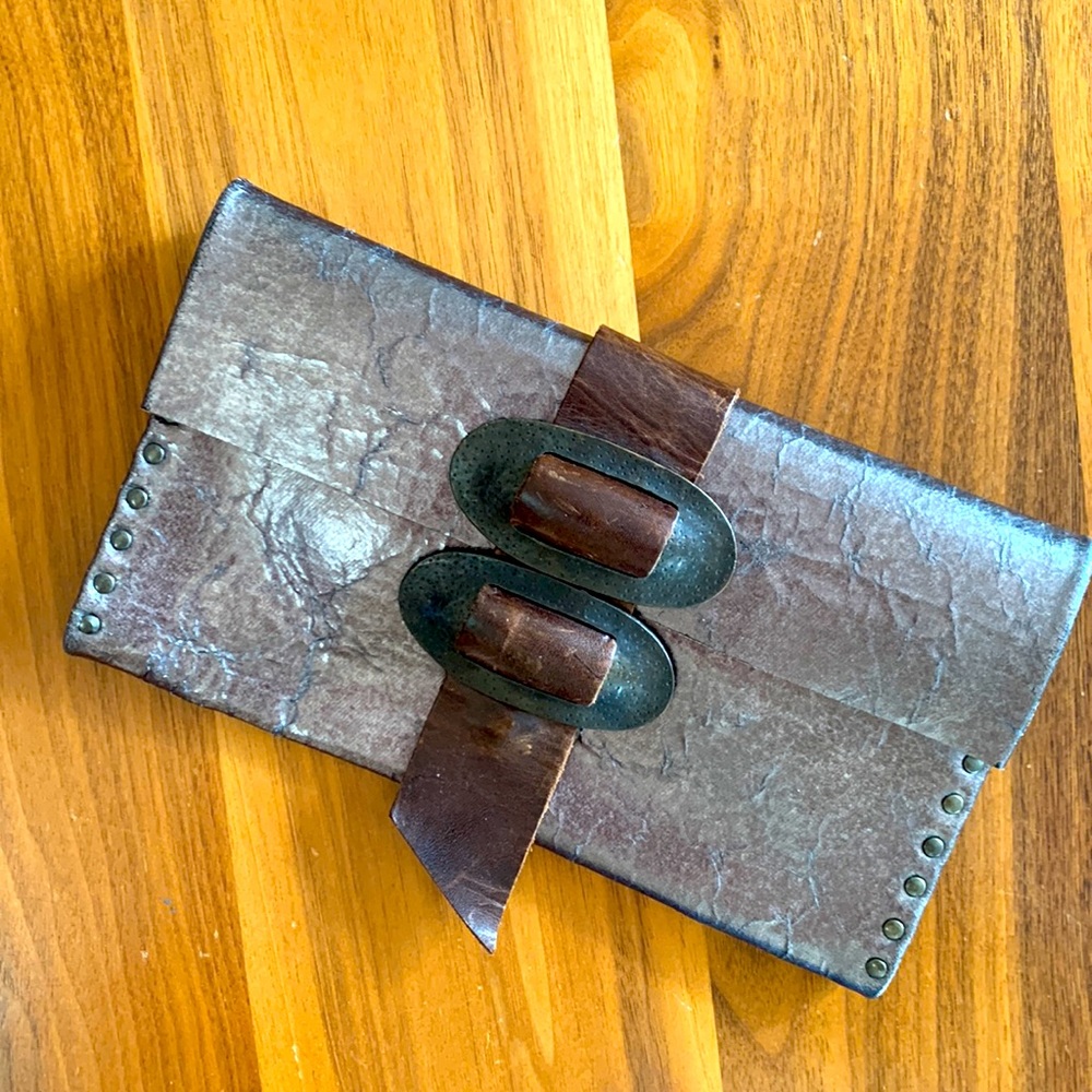 Rebel Designs, Brooklyn. Leather Gunmetal clutch w/ antique brass buckle.